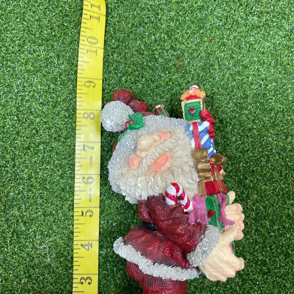 Resin Santa Holding Christmas Presents Figurine 9